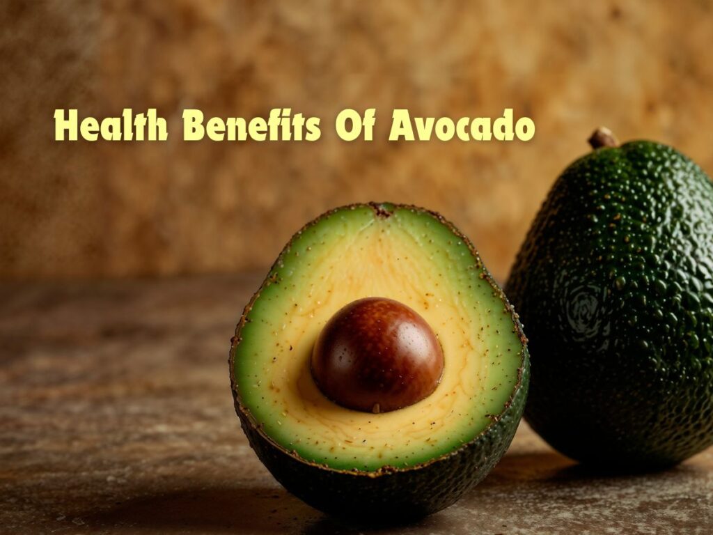 Fresh ripe avocado cut in half with seed exposed, highlighting health benefits of avocado on a rustic background.