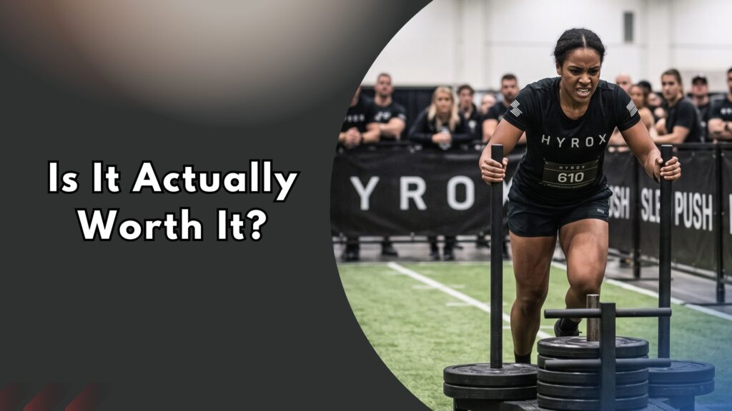Woman performing Hyrox sled push station during race, text reads "Is It Actually Worth It?"