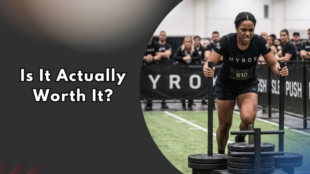 Is-hyrox-Actually-Worth-It Woman performing Hyrox sled push station during race, text reads "Is It Actually Worth It?"