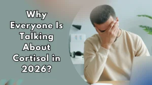 Man stressed at desk representing high cortisol levels in 2026