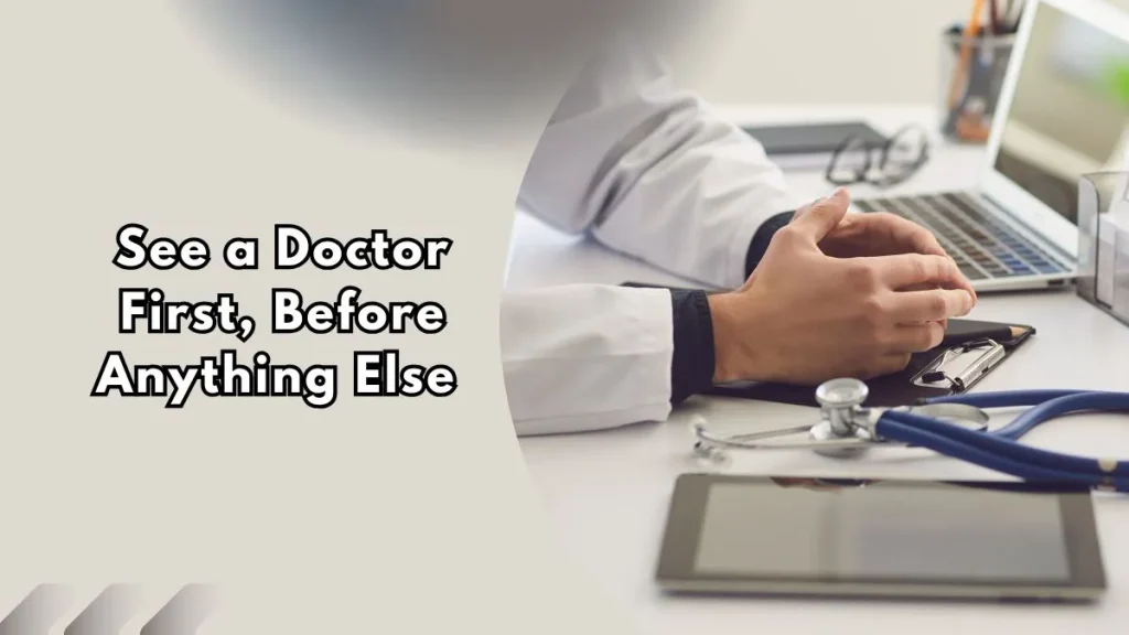 See-a-Doctor-First-Before-Anything-Else A doctor's hands resting on a clipboard beside a stethoscope and laptop on a desk, text overlay reads "See a Doctor First, Before Anything Else"