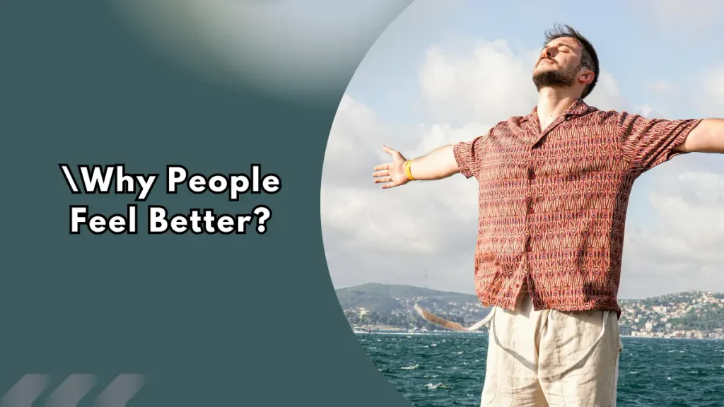 Man with arms spread wide and eyes closed, facing the sun by the sea, beside the text Why People Feel Better